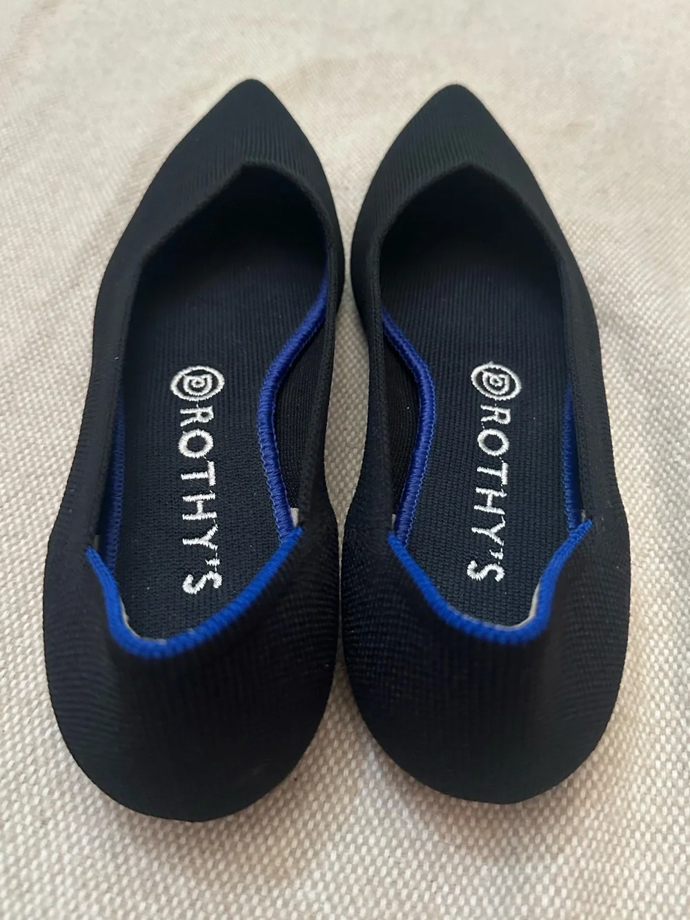 Rothy's Black Pointed Knit Flats with Blue Heel Trim